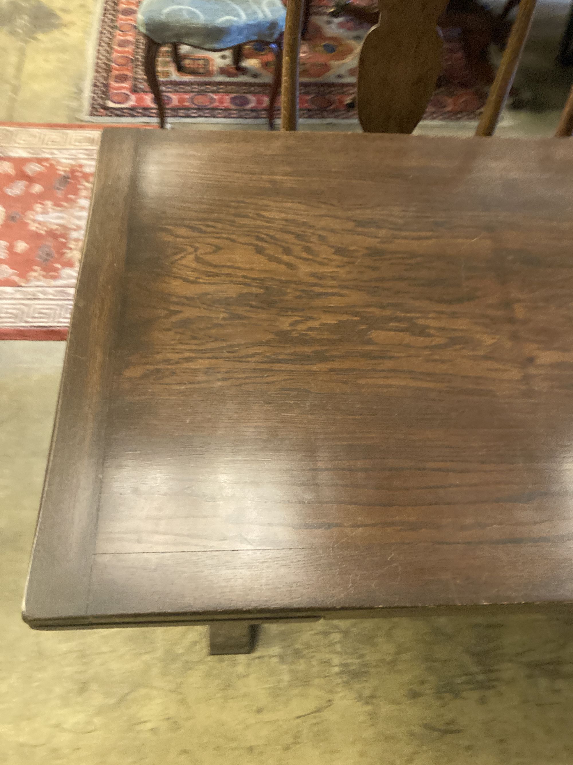 An 18th century style oak draw leaf dining table, width 150cm, depth 75cm, height 77cm